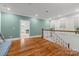Upstairs hallway featuring hardwood floors, natural light, and access to other rooms at 319 Catawba Ave, Rock Hill, SC 29730