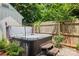 Inviting hot tub on a patio in a lush backyard at 319 Catawba Ave, Rock Hill, SC 29730