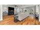 Open concept living room featuring dark fireplace and large sofa with hardwood flooring at 319 Catawba Ave, Rock Hill, SC 29730