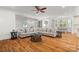 Large living room with sectional sofa, hardwood flooring, and multiple windows at 319 Catawba Ave, Rock Hill, SC 29730