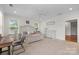 Well-lit main bedroom boasts hardwood floors, a ceiling fan, and ample closet space at 319 Catawba Ave, Rock Hill, SC 29730