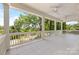 Large covered porch with patterned tile, ceiling fans, and a scenic outdoor view at 319 Catawba Ave, Rock Hill, SC 29730