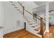Elegant staircase with hardwood steps and white railings, showcasing the home's design at 319 Catawba Ave, Rock Hill, SC 29730