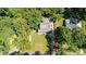 Aerial view showcases the home's private lot, landscaping, and proximity to mature trees and surrounding neighborhood at 408 Camelot Dr, Salisbury, NC 28144