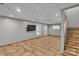Finished basement with tile flooring, recessed lighting, and staircase leading to the upper level at 408 Camelot Dr, Salisbury, NC 28144