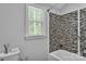 Cozy bathroom featuring tiled shower, window, and modern fixtures at 408 Camelot Dr, Salisbury, NC 28144