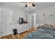 Cozy bedroom features hardwood floors, neutral walls, and a ceiling fan for optimal comfort at 408 Camelot Dr, Salisbury, NC 28144