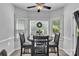 Cozy dining area with natural light and a ceiling fan for added comfort at 408 Camelot Dr, Salisbury, NC 28144