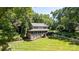 Picturesque home with a large front yard, expansive porch, and mature trees providing privacy at 408 Camelot Dr, Salisbury, NC 28144