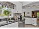 Updated kitchen features granite countertops, stainless steel appliances, and white cabinets at 408 Camelot Dr, Salisbury, NC 28144