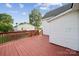 A spacious wooden deck with views of the backyard, perfect for outdoor entertaining and relaxation at 411 S Central Ave, Landis, NC 28088