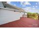 Back deck view showcases the home's exterior, railings, and landscaping at 411 S Central Ave, Landis, NC 28088