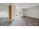Bonus room with tile and carpet, a storage closet, an exterior door, and ample light at 411 S Central Ave, Landis, NC 28088