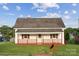 Charming home featuring a covered porch and a well-maintained front lawn at 411 S Central Ave, Landis, NC 28088