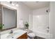 Bright bathroom features a framed mirror, white fixtures, and combined shower and tub at 5437 Mallard Ln, Gastonia, NC 28052