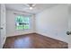 Bright and airy bedroom with hardwood floors, offering a serene and comfortable space at 5437 Mallard Ln, Gastonia, NC 28052