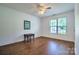 Well-lit, adaptable bedroom featuring a window with a view and hardwood floors at 5437 Mallard Ln, Gastonia, NC 28052