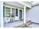Inviting front porch with seating, creating a cozy and welcoming entrance to the home at 5437 Mallard Ln, Gastonia, NC 28052