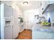 Efficient kitchen featuring white appliances, wood floors, and a stylish countertop at 5437 Mallard Ln, Gastonia, NC 28052