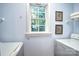 The laundry room showcases a bright window and convenient shelving for storage at 5437 Mallard Ln, Gastonia, NC 28052