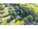 Aerial view of a home highlighting its spacious lot, mature trees, and proximity to neighborhood amenities and services at 5476 Twelve Oak Ln, Conover, NC 28613