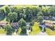 Aerial view of a home showcasing its peaceful setting, surrounded by lush trees, and highlighted by a property line at 5476 Twelve Oak Ln, Conover, NC 28613