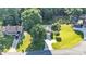 An aerial view showcasing the home's lush surroundings, expansive lot, driveway, and beautiful landscaping at 5476 Twelve Oak Ln, Conover, NC 28613