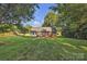 Expansive backyard offers privacy and endless possibilities for outdoor activities and relaxation, perfect for enjoying nature at 5476 Twelve Oak Ln, Conover, NC 28613