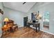 Office space with vaulted ceiling, wood floors, brown leather chair and desk by window at 5476 Twelve Oak Ln, Conover, NC 28613