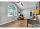 Bright office space with arched window, wood floors, brown leather chair and wooden desk at 5476 Twelve Oak Ln, Conover, NC 28613