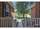 View from the front porch overlooking the neighborhood with green lawns and mature trees at 5476 Twelve Oak Ln, Conover, NC 28613