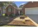 Inviting brick home with a well-manicured front yard and convenient two-car garage at 5476 Twelve Oak Ln, Conover, NC 28613