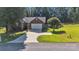 Beautiful brick home featuring a well-kept lawn, mature trees, and a convenient two-car garage at 5476 Twelve Oak Ln, Conover, NC 28613