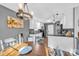 Kitchen with white cabinets, gray walls, and black countertops and appliances at 5476 Twelve Oak Ln, Conover, NC 28613