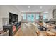 Spacious living room with hardwood floors, recessed lighting, and access to the backyard through glass doors at 5476 Twelve Oak Ln, Conover, NC 28613