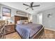 Bedroom showcasing a large bed with wooden headboard and neutral color scheme at 5476 Twelve Oak Ln, Conover, NC 28613