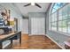 This home office features wood floors, neutral paint, closet, and a large arched window that provides plenty of natural light at 5476 Twelve Oak Ln, Conover, NC 28613