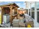 Cozy backyard patio with a wooden gazebo and outdoor bar, perfect for entertaining at 5580 Soft Shell Dr, Lancaster, SC 29720