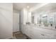 Bright bathroom featuring double sinks, white cabinetry and an enclosed glass shower at 5580 Soft Shell Dr, Lancaster, SC 29720