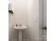 Elegant pedestal sink with modern fixtures and ample toilet paper storage for convenience at 5580 Soft Shell Dr, Lancaster, SC 29720