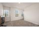 Bright bedroom with two large windows, neutral carpet, and a view to the outside at 5580 Soft Shell Dr, Lancaster, SC 29720