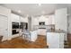Modern kitchen featuring white cabinets, granite countertops, stainless steel appliances and a large island at 5580 Soft Shell Dr, Lancaster, SC 29720