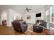 Living room with wood floors, comfortable seating, fireplace, and natural light at 5580 Soft Shell Dr, Lancaster, SC 29720