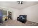 Cozy living room featuring comfy recliners, a fan, and plenty of space for relaxation at 5580 Soft Shell Dr, Lancaster, SC 29720