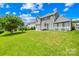 Manicured backyard featuring a large, grassy lawn at 586 Brookhaven Dr, Fort Mill, SC 29708