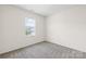 Bedroom featuring neutral carpet, and a bright window with blinds at 586 Brookhaven Dr, Fort Mill, SC 29708