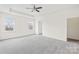 Large bedroom with tray ceiling, carpeted floors, and bright, airy feel at 586 Brookhaven Dr, Fort Mill, SC 29708