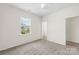 Bedroom featuring neutral carpet, ceiling fan, and a bright window with blinds at 586 Brookhaven Dr, Fort Mill, SC 29708