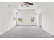 Spacious bedroom with tray ceiling, neutral carpet, and lots of natural light at 586 Brookhaven Dr, Fort Mill, SC 29708