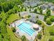 Aerial view of a sparkling community pool with lounge chairs and manicured landscaping at 586 Brookhaven Dr, Fort Mill, SC 29708